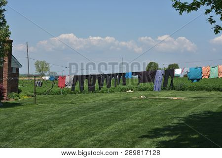 Mennonite Clothing On A Line Drying In Lancaster County.