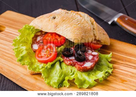 Panini Sandwiches With Fresh Tomatoes And Mozzarella And Prosciutto Ham