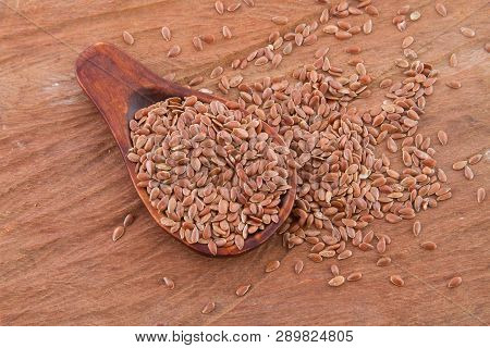 Flaxseed Grains In Wooden Spoon, Close-up Image