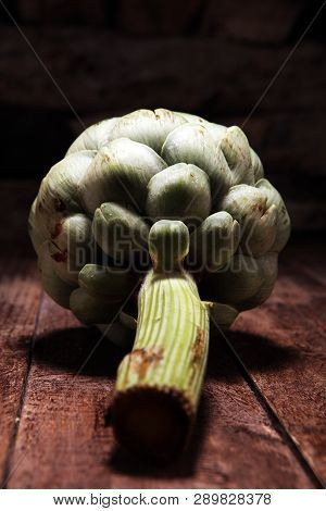 Artichokes On Rustic Background. Fresh Organic Artichoke Flower Set