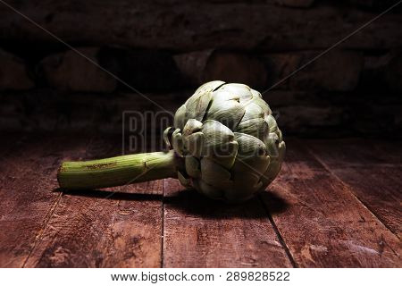 Artichokes On Rustic Background. Fresh Organic Artichoke Flower Set