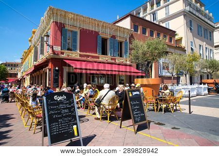 Nice, France - April 18 2017. Restaurant In Old Town Of Nice. Colorful Old Medieval Architecture.