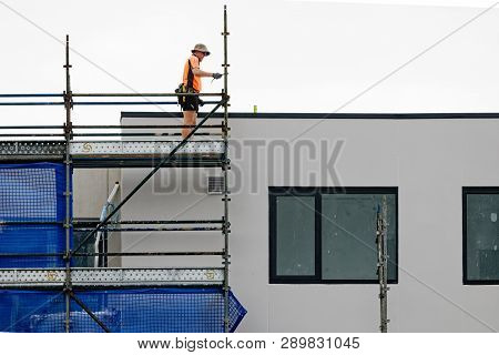 Gosford, New South Wales, Australia - February 21, 2019: Removing Scaffolding And Safety Netting On 
