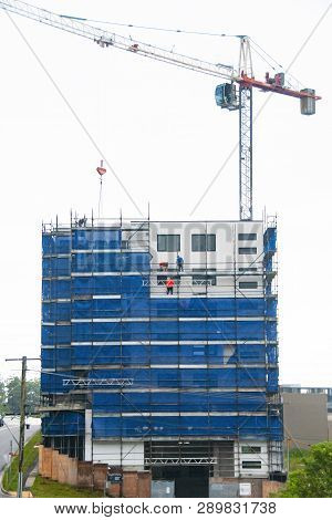 Gosford, New South Wales, Australia - February 21, 2019: Removing Scaffolding And Safety Netting On 