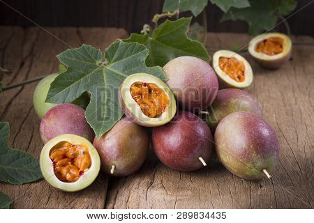 Fruits Of Gulupa On Vine Wood Table, Passiflora Pinnatistipula