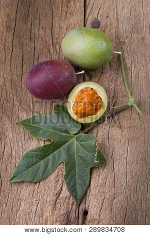 Fruits Of Gulupa On Vine Wood Table, Passiflora Pinnatistipula
