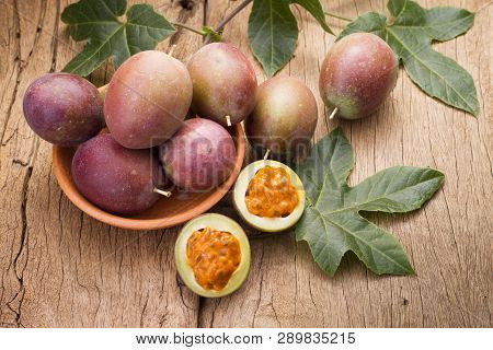 Fruits Of Gulupa On Vine Wood Table, Passiflora Pinnatistipula