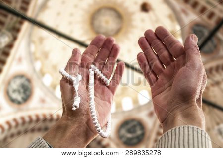 Muslim Man With Rosary Beads Praying Inside The Mosque