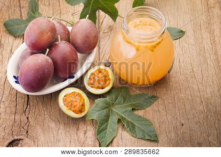 Fruits Of Gulupa On Vine Wood Table, Passiflora Pinnatistipula