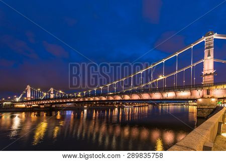 Krymsky Bridge Or Crimean Bridge  Across The Moskva River In Moscow In The Rays Of Setting Sun In Th
