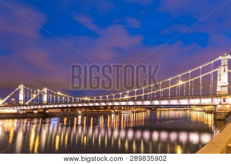 Krymsky Bridge Or Crimean Bridge  Across The Moskva River In Moscow In The Rays Of Setting Sun In Th