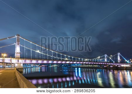 Krymsky Bridge Or Crimean Bridge  Across The Moskva River In Moscow In The Rays Of Setting Sun In Th