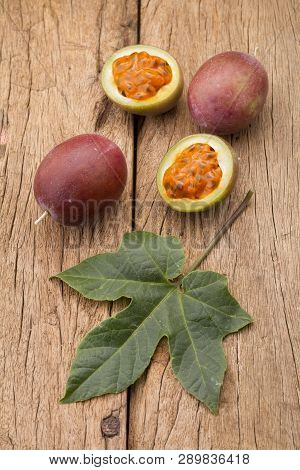 Fruits Of Gulupa On Vine Wood Table, Passiflora Pinnatistipula