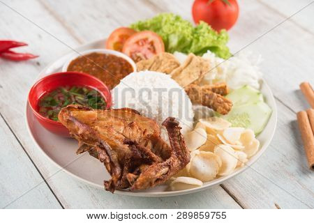 Nasi lemak kukus with fried chicken, popular traditional Malaysian local food.