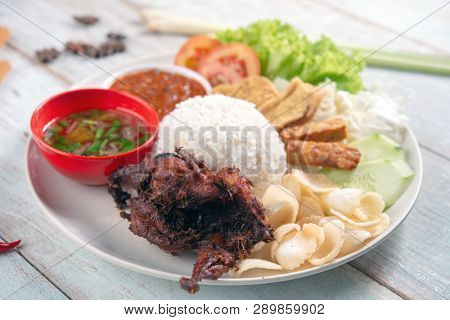 Nasi lemak kukus with quail meat, popular traditional Malaysian local food.