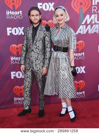 LOS ANGELES - MAR 14:  Zedd and Katy Perry arrives for the iHeart Radio Music Awards 2019 on March 14, 2019 in Los Angeles, CA