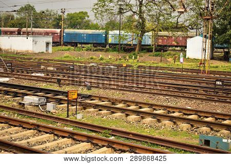 Railway Tracks Lies Together. An Old Rail Coach Gathered Beside The Rail Tracks.