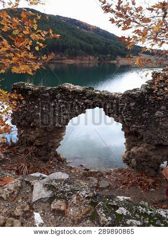 Quiet Lake With Mountain Views And Stone Decoration