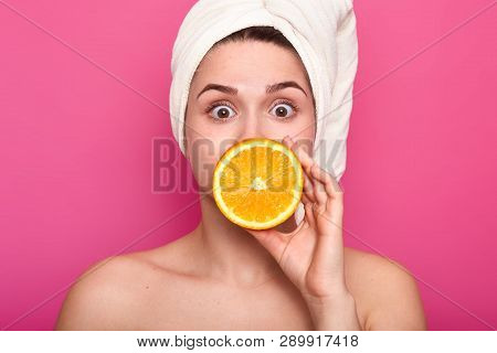Portrait Of Beautiful Surprised Girl With Towel On Head And Nacked Shoulders. Attractive Woman With 