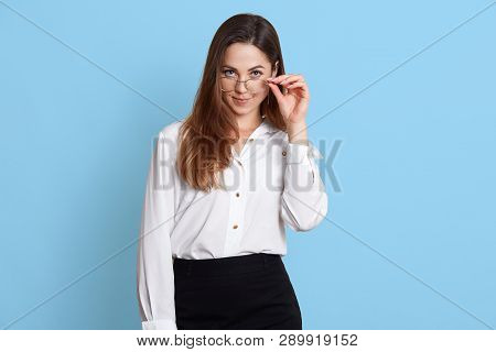 Closeup Portrait Of Woman Holds Glasses With Hand And Looks At Camera. Business Lady Wears White Shi