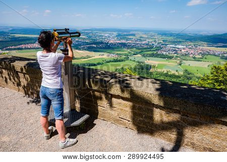 Woman tourist on the observation deck, viewing platform Hohenzollern Castle, Germany