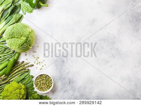 Assorted Green Toned Raw Organic Vegetables On White Background. Avocado, Cabbage, Broccoli, Caulifl