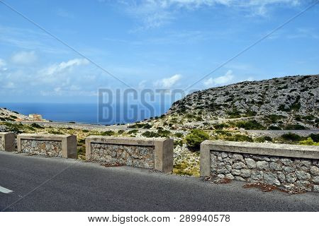 Amazing Landscape When Driving On An Open Coastal Road Winding Through To Lighthouse Cap Formentor