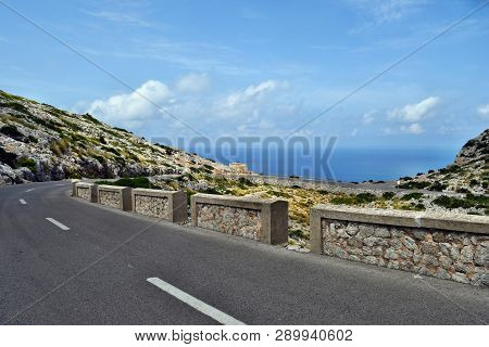 Amazing Landscape When Driving On An Open Coastal Road Winding Through To Lighthouse Cap Formentor