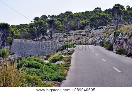 Open Coastal Road Winding Through To Lighthouse Cap Formentor