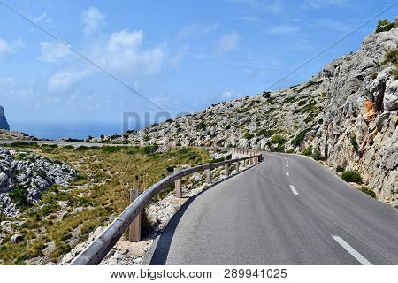 Open Coastal Road Winding Through To Lighthouse Cap Formentor