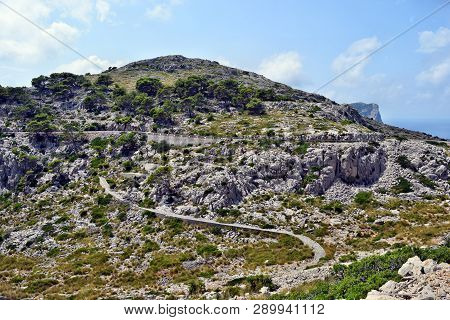 Open Coastal Road Winding Through To Lighthouse Cap Formentor