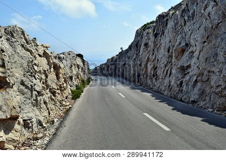 Open Coastal Road Winding Through To Lighthouse Cap Formentor