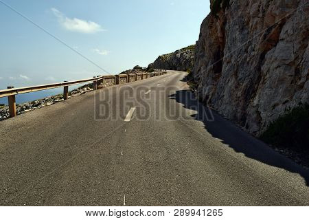 Open Coastal Road Winding Through To Lighthouse Cap Formentor