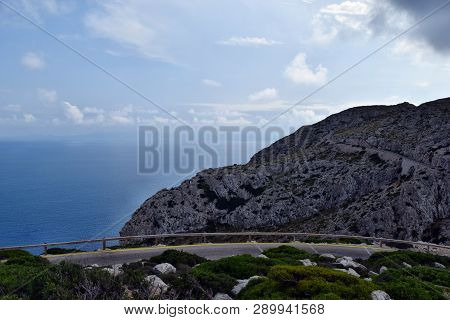 Amazing Landscape When Driving On An Open Coastal Road Winding Through To Lighthouse Cap Formentor