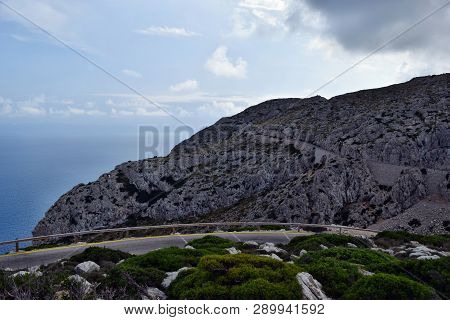 Amazing Landscape When Driving On An Open Coastal Road Winding Through To Lighthouse Cap Formentor