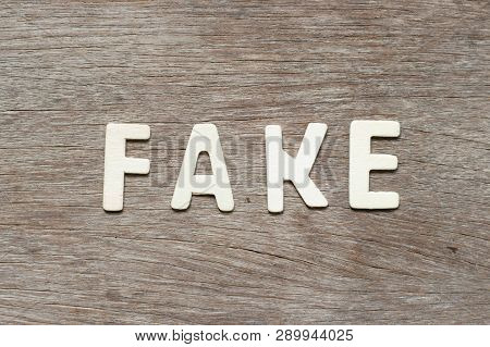 Alphabet Letter In Word Fake On Wood Background