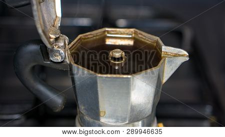 Moka On The Stove. Italian Old Coffee Maker With Hot Espresso Inside, Open A Coffee Pot, Steam Comes