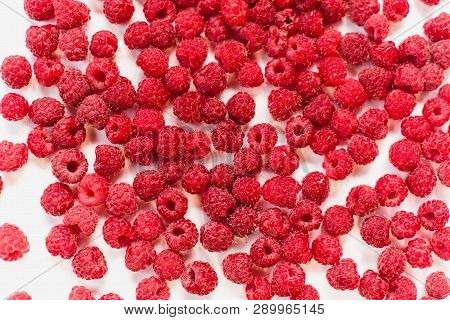 Dripping Frash Raspberry On The White Background.