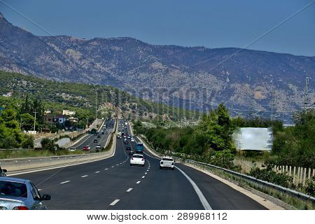 Long Highway Road Overlooking Big High Mountains