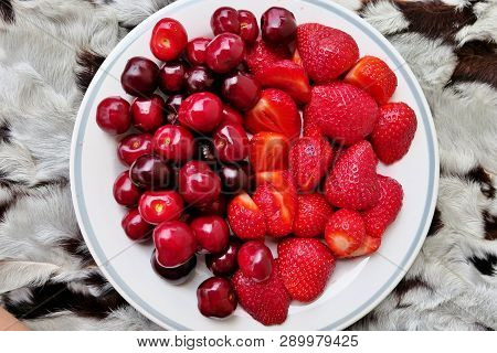 Red Ripe Fruit Strawberry And Cherry On A Plate