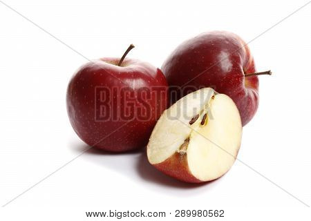 Red Sweet Ripe Apples On A White Background. A Piece Of Apple Isolation.