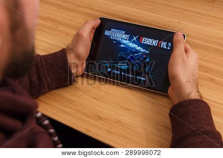 Prague, Czech Republic - March 16, 2019: Man Holding A Smartphone And Playng The Minecraft Mobile Ga