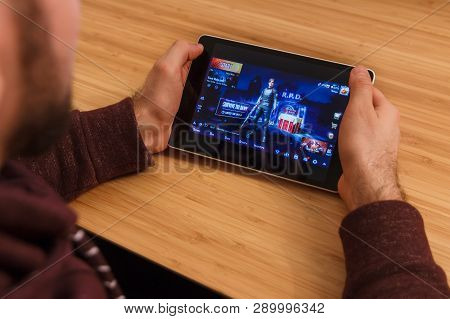 Prague, Czech Republic - March 16, 2019: Man Holding A Smartphone And Playng The Minecraft Mobile Ga