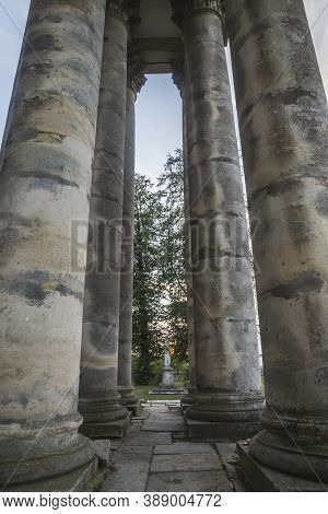 Colonade Near The Abandoned Church In The Evening