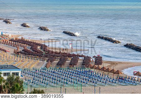 Montesilvano, Italy. June 16, 2020: Aerial View Of The Beach On The Adriatic Coast. Multitude Of Umb