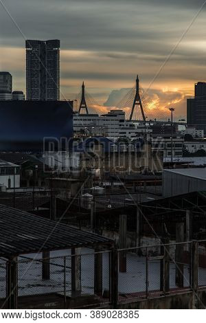View Of Bhumibol Suspension Bridge Cross Over Chao Phraya River In Bangkok City At Beautiful Sunset 