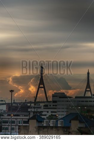 View Of Bhumibol Suspension Bridge Cross Over Chao Phraya River In Bangkok City At Beautiful Sunset 