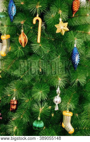 fir tree decorated with sticks, lights and toys in preparation for the celebration of Christmas