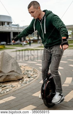 Man Riding Electric Mono Cycle On Street