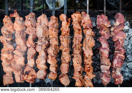 The Meat Is Grilled On Charcoal, Top View. Cooking Barbecue Outdoors